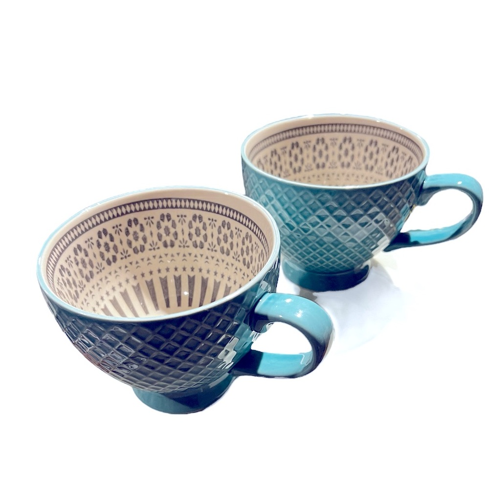 Two teal mugs